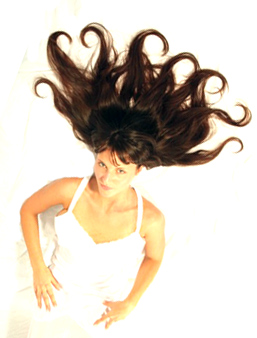 image of a gorgeous girl in a white slip on a white background with long dark hair